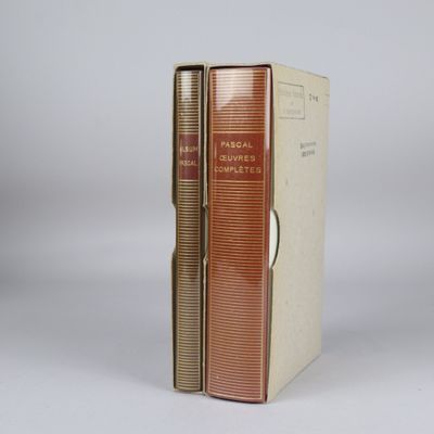 an old book sitting on top of a white table