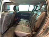 the interior of a car with leather seats and a steering wheel