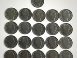 a lot of coins that are sitting on a table