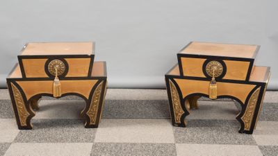 two side tables with a clock on each of them sitting on a checkered floor
