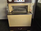 a machine that is sitting in the corner of a room