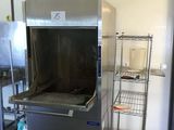 a large stainless steel oven in the middle of a kitchen