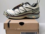 salomon shoes in a box on top of a table