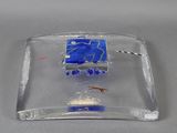 a glass plate with a blue and white design on it