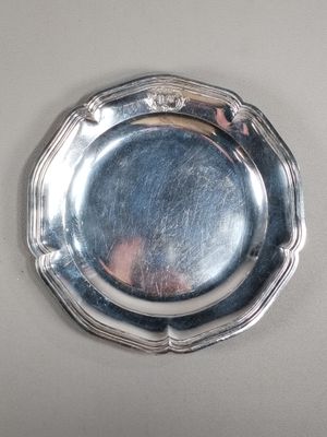 a silver plate that is on a table