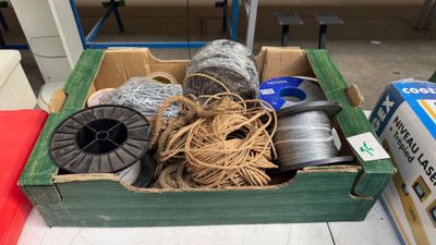 a box full of different types of wire and spools