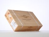an open wooden box with a label on it sitting on a table
