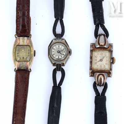 three different types of watches are displayed on a white surface