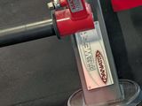 a red fire hydrant that is on a metal stand