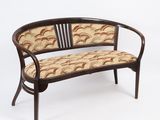 an image of a wooden bench with a patterned upholstered seat