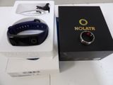 a box with a watch inside of it on a table
