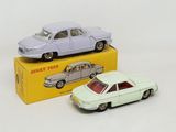 two toy cars that are sitting next to each other