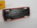 a toy train that is sitting next to a box of toys