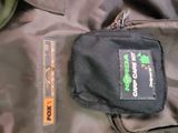 a black jacket with a green patch on it