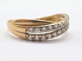 an image of a gold ring with diamonds on it