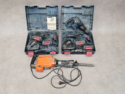 an image of two electric tools in a case on the floor