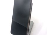 a cell phone that is sitting on top of a stand