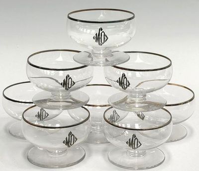 six clear glass bowls with black rims and a monogrammed monogram