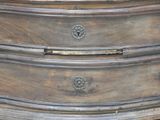 an image of a wooden dresser with brass hardware