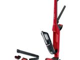 un gros plan d'un aspirateur rouge muni d'une poignée noire