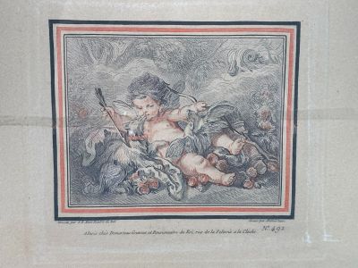an old picture of a woman with a baby in her lap