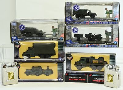 four different toy trains in boxes on a table
