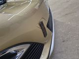 a close up of a car ' s emblem on the front of the car