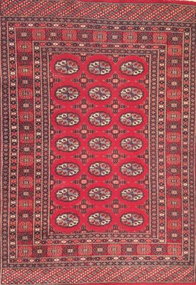 a red and black rug with a pattern on it