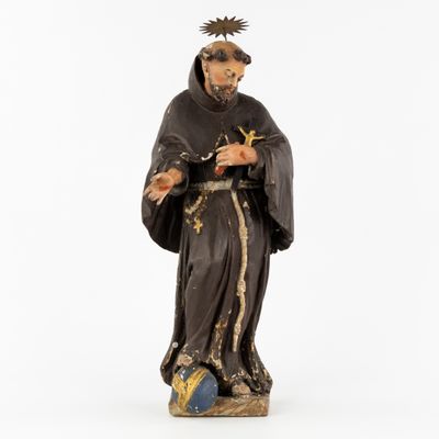 a statue of a man with a crown on his head