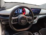the interior of a car with a steering wheel, dashboard, and display screen