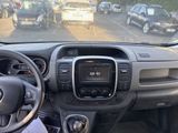 a dashboard view of a car with a lot of cars in the background