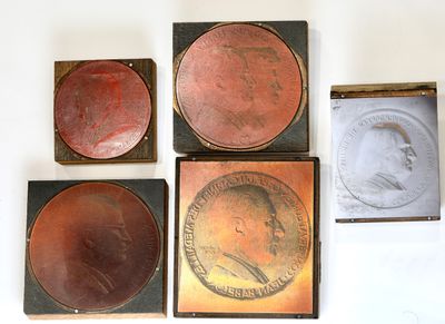 four different types of coins are displayed on a white surface