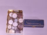 a small box with a bunch of watches inside of it