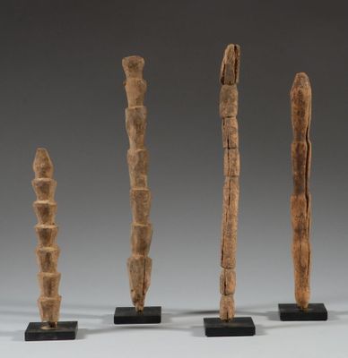 three pieces of wood are sitting on a table
