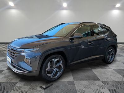 a gray 2021 hyundai kona suv parked in a showroom