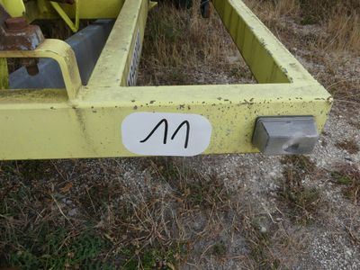 a close up of a yellow trailer with a number on it