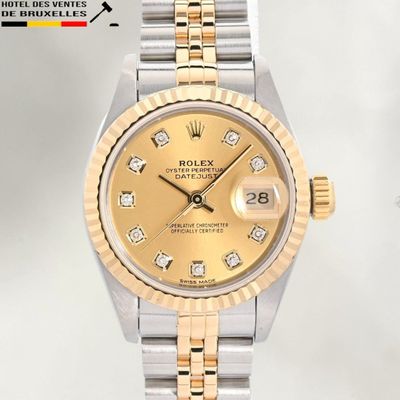 an image of a gold and silver rolex watch with diamonds