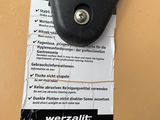 a close up of a cell phone with a tag attached to it