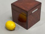 a small wooden box with a lemon on it