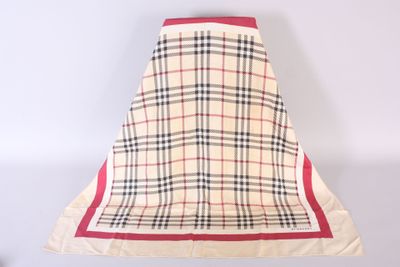 beige and black plaid skirt with red trim