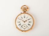 a gold pocket watch with roman numerals on it
