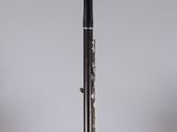 a close up of a black and silver pen sitting on top of a clear box