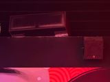 a red light that is shining on a black table