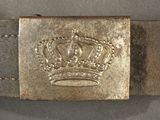 a close up of a belt with a crown on it