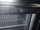 a black oven with a door open in a kitchen