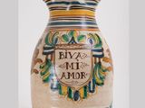 a vase that has been decorated with a name on it