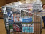 a woman standing next to a cart full of boxes