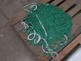 a pile of green and white rope on a pallet