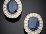 a pair of sapphire and diamond earrings