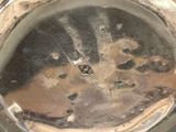 a close up view of a metal object with holes in it